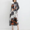 This dress for women exudes a sense of high-end fashion and elegance. It features printed lantern sleeves, loose, large-sized, semi-high-neck long skirt, a Middle Eastern style details Picture